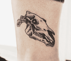 animal dinosaur skull tattoo